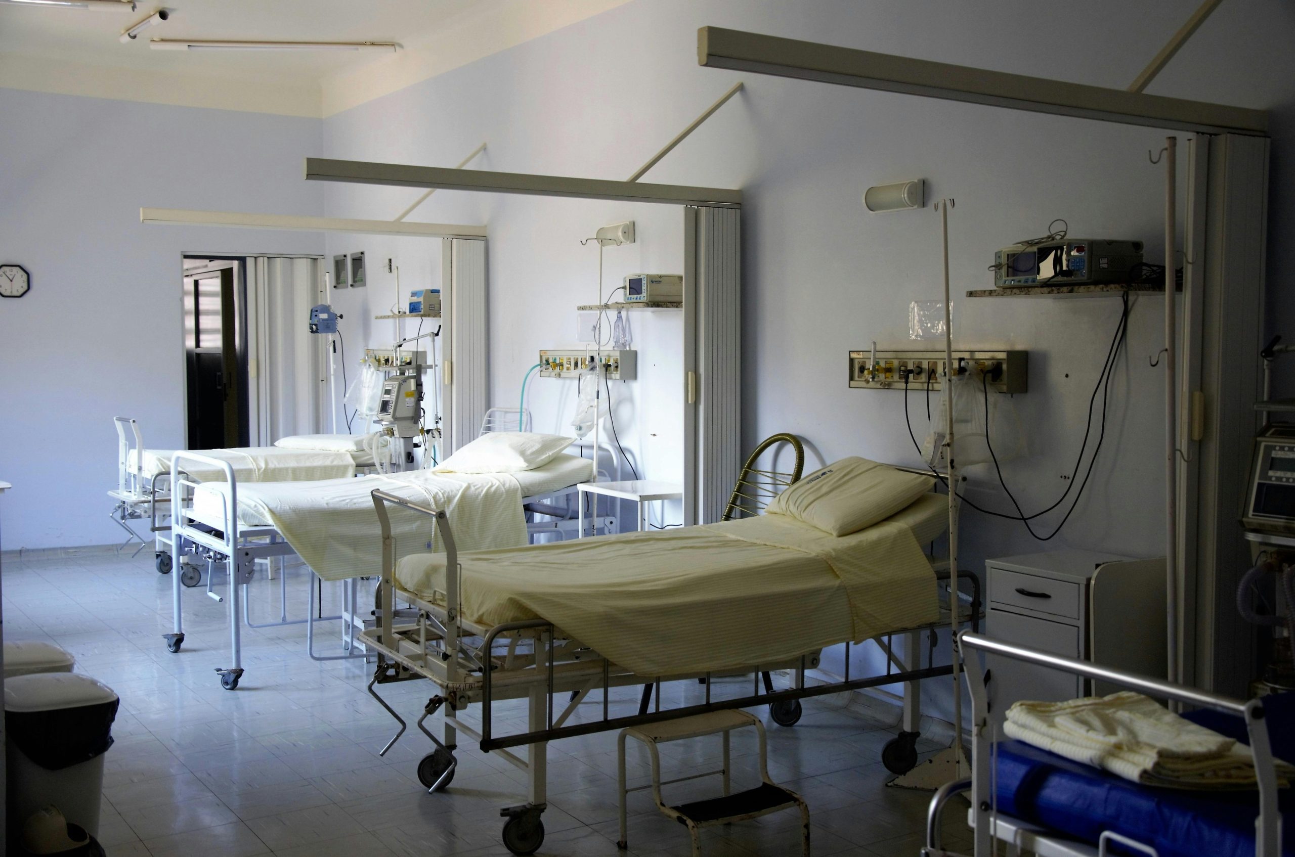 Image of a hospital room with beds and medical equipment, showcasing OFAMS hospital beds and cost-effective supplies